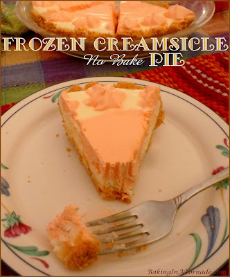 Frozen Creamsicle No Bake Pie takes you back to those warm summer days of your childhood. | Recipe developed by www.BakingInATornado.com | #recipe #dessert