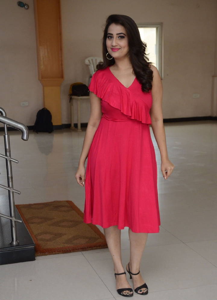 Glamorous Indian TV Model Manjusha Hot Long Cross Legs Stills In Red Dress