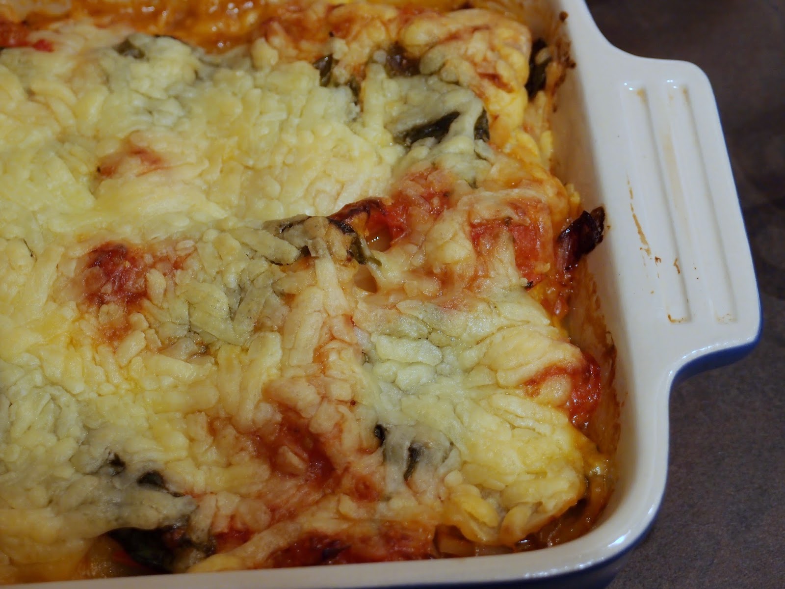 Mushroom and spinach lasagne with roasted tomato sauce and fried halloumi
