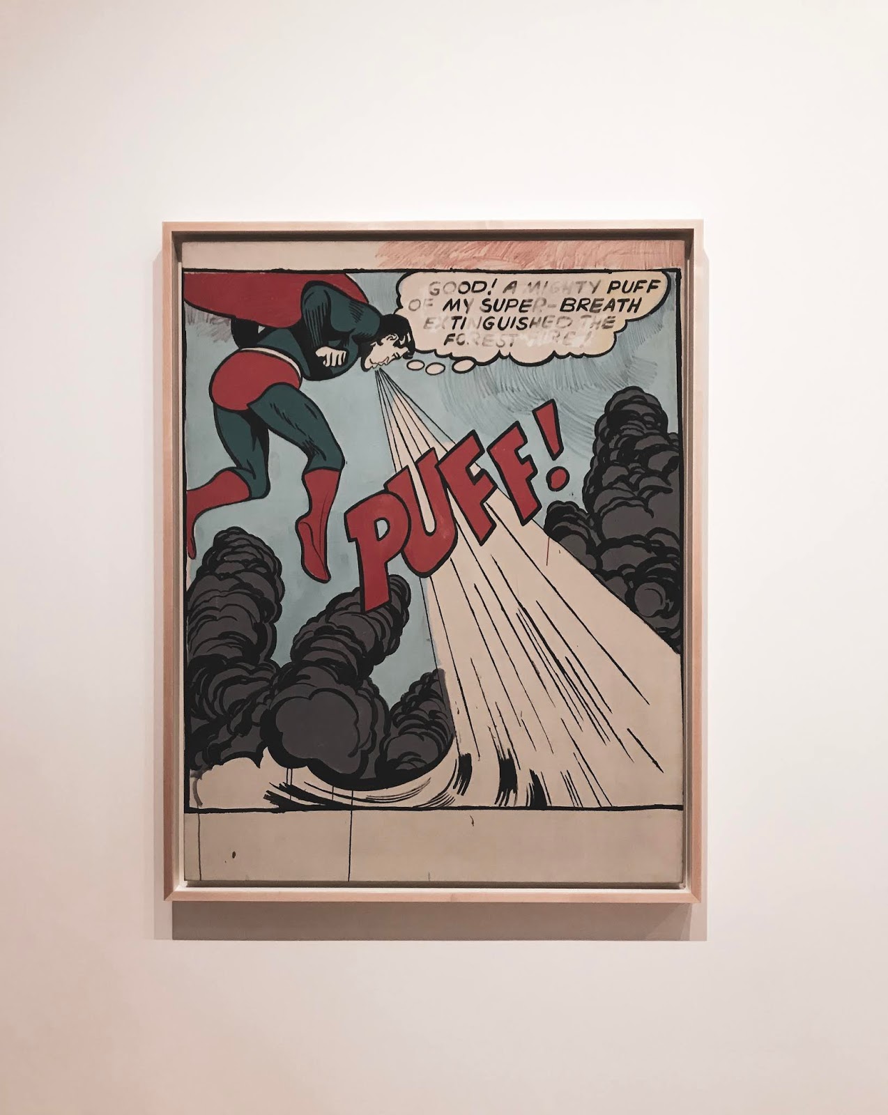 Photoframe where Superman is trying to extinquish wildfire by blowing into it in Whitney Museum of American Art