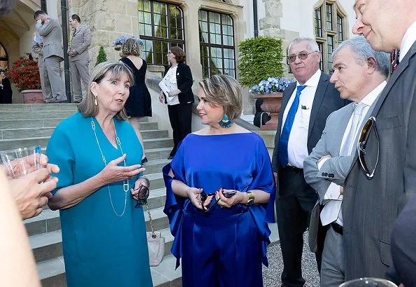 Duke Henri, Maria Teresa, Prince Guillaume and Princess Stephanie at a reception. Maria Teresa wore blue dress, Stephanie wore Prada floral dress