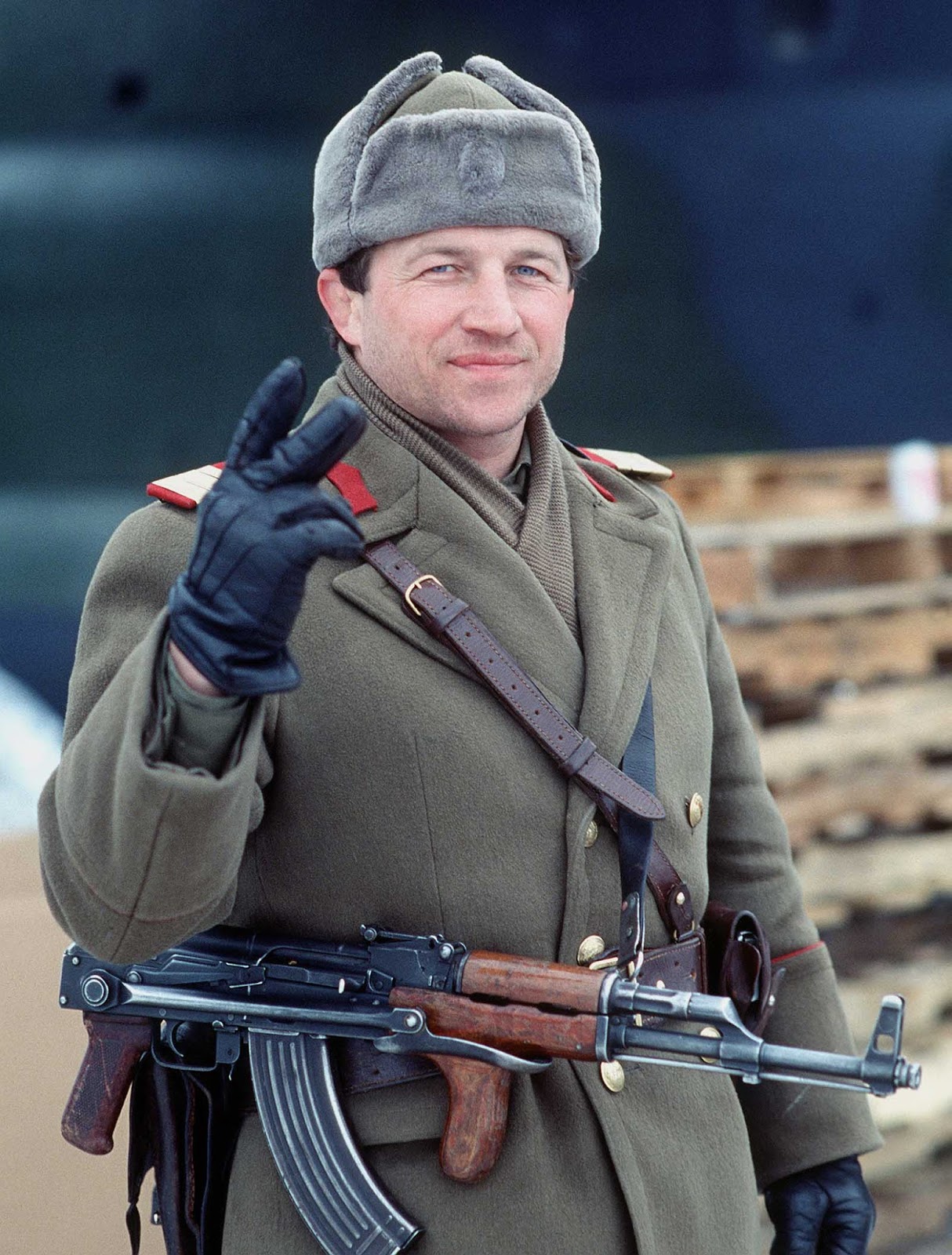A Romanian soldier gives the victory sign on New Year's Eve 1989, he has removed the communist insignia from his headwear.