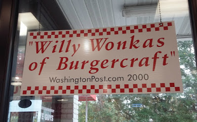Sign in the window at Five Guys Restaurant
