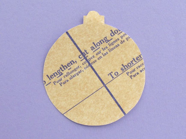 Crafty Christmas Bauble Tutorial: Make a Sewing-Themed Ornament for Your Tree! Bauble shape decorated with an old sewing pattern