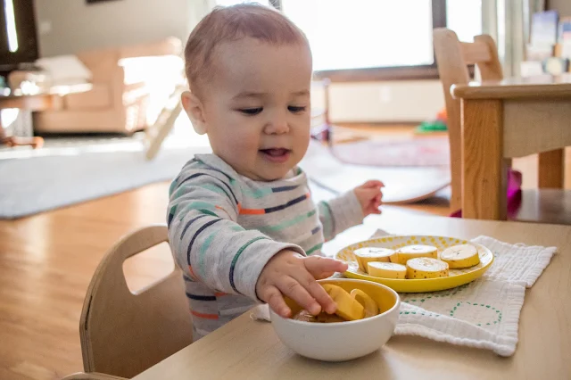 Peeling bananas is a great first way to involve your young Montessori toddler in the kitchen