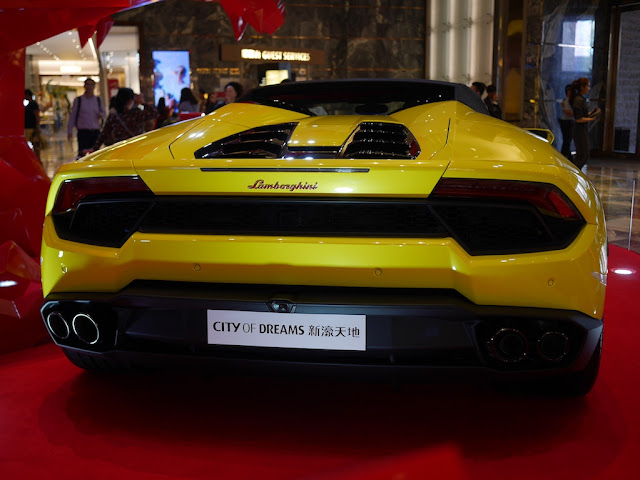 back of yellow Lamborghini on display at City of Dreams Macau