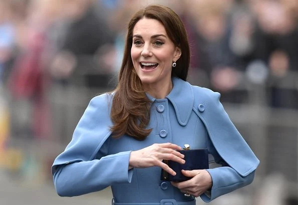 Kate Middleton wore Mulberry blue Ashleigh cape coat and a new Jenny Packham dress.The Duchess is wearing a cape coat by Mulberry