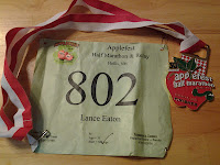 Lance Eaton's racing number and medal for his first half-marathon.