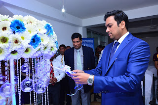 Dr. Hiran Hettiarachchi (MBBS-Colombo, MBA - Australia) - Group Chairman, Blue Mountain Group of Companies lights a ceremonial lamp to declare the branch open