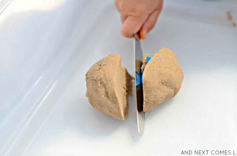 Slicing kinetic sand with a knife