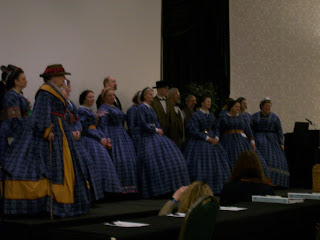 Symposium faculty in their blue dresses. Symposium faculty in their blue dresses.