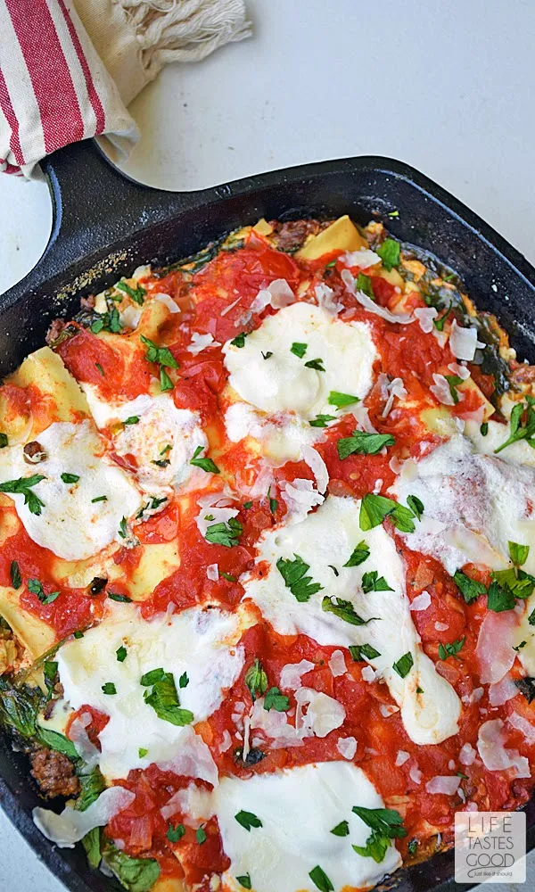 Cheesy Skillet Lasagna | by Life Tastes Good is so much easier to make than traditional lasagna, and it has all the same great tastes! I love all the fresh ingredients in this easy skillet lasagna. It is loaded with 3 different types of cheese, fresh tomatoes, spinach, and herbs for a satisfying meal the whole family will love!