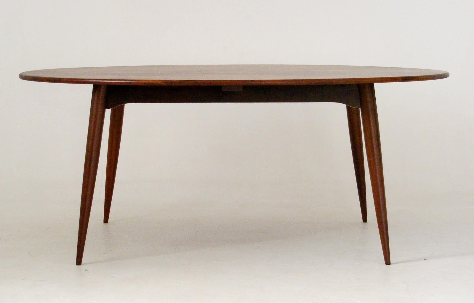 VAMP FURNITURE An exceptional solid Imbuia wood midcentury dining table by EE Meyer for