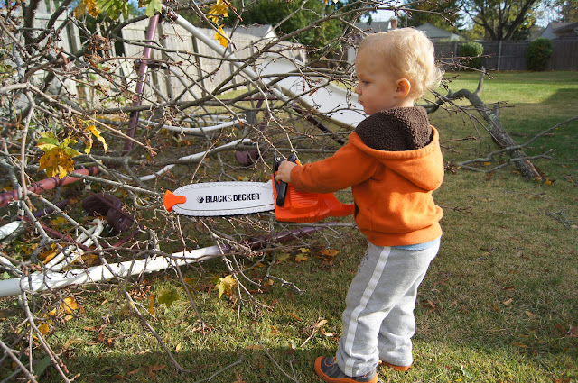 toddler with chainsaw