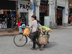woman selling fruit from a bike