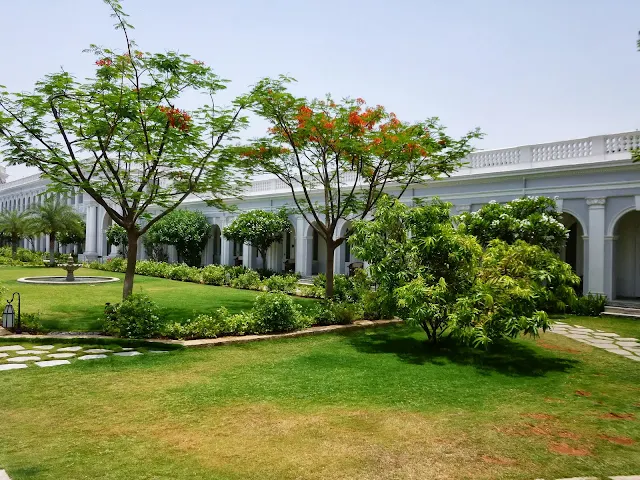 Falaknuma Palace Hyderabad Images: Flowering trees in the courtyard