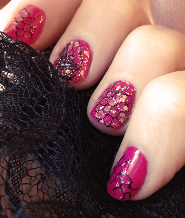 pink nails with fishnet and gold glitter