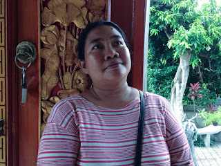 Traveler Woman Looking At The Wall Of Buddhist Shrine Room At Buddhist Monastery North Bali Indonesia
