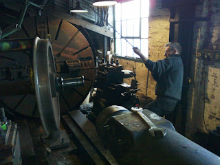 Lifting the axle into the ex Consett ironworks wheel lathe