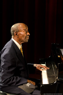 man playing piano from the Harlem Blues and Jazz band