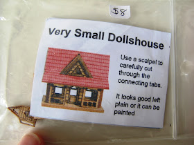 'Very small dollshouse' kitset with thumb for scale.