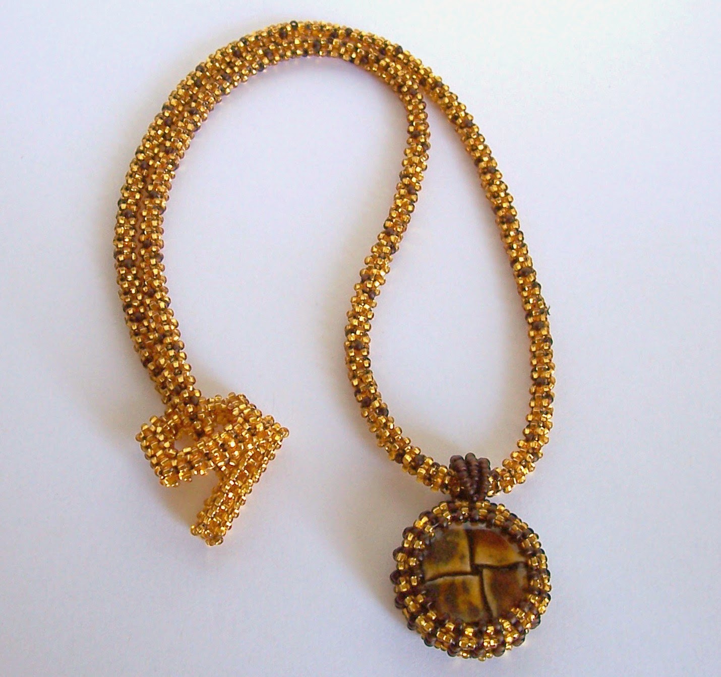 https://www.etsy.com/listing/129452494/gold-dust-beadwoven-necklace-with?ref=shop_home_active_7