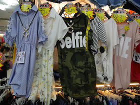 dress with camouflage pattern and the word "Selfie"