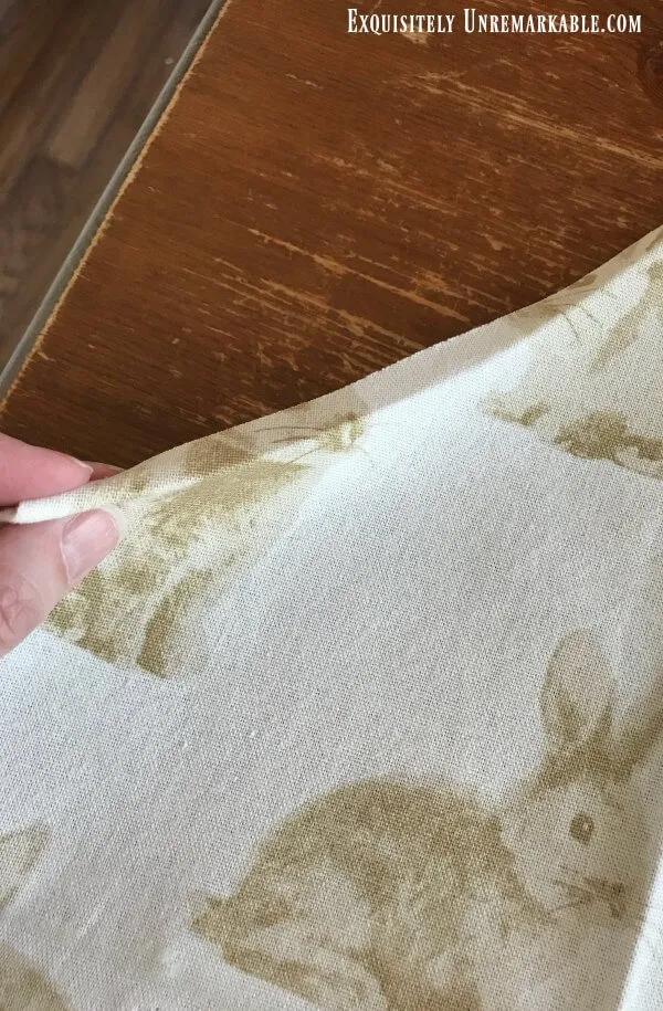 Folding over towel edge to make seam