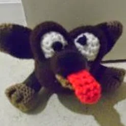 http://www.craftsy.com/pattern/crocheting/toy/doggie-door-prop-a-crochet-pattern/82576