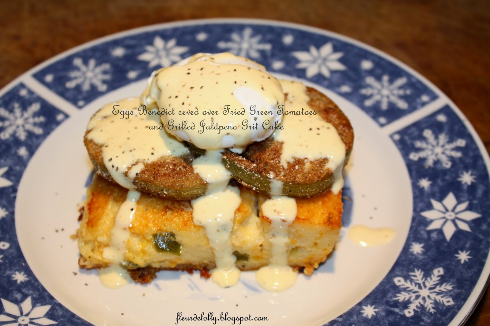 Fleur de Lolly Eggs Benedict served over Fried Green Tomatoes and Grilled Jalapeno Grit Cake