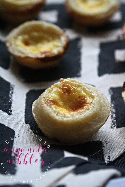 These mini gluten free Portuguese tarts arethe perfect flaky treat, filled with rich custard and a hint of cinnamon and vanilla!