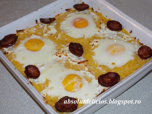 BAKED POLENTA LAYERED WITH SAUSAGES, FETA CHEESE AND EGGS