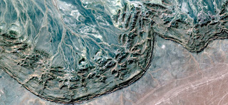 petrified ocean wave, abstract landscapes from the air from the deserts of Africa, Surreal, Collection of Abstract Naturalism Munimara, green stone textures, hallucination, adventure, earth, failure, view, picasso, sand, dune, drought, arid, pollock, kandinsky, mountain, composition, dreams, background,
