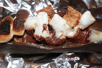 this is an air fried banana stuffed with toasted marshmallows, hershey chocolate bars and graham cracker cereal