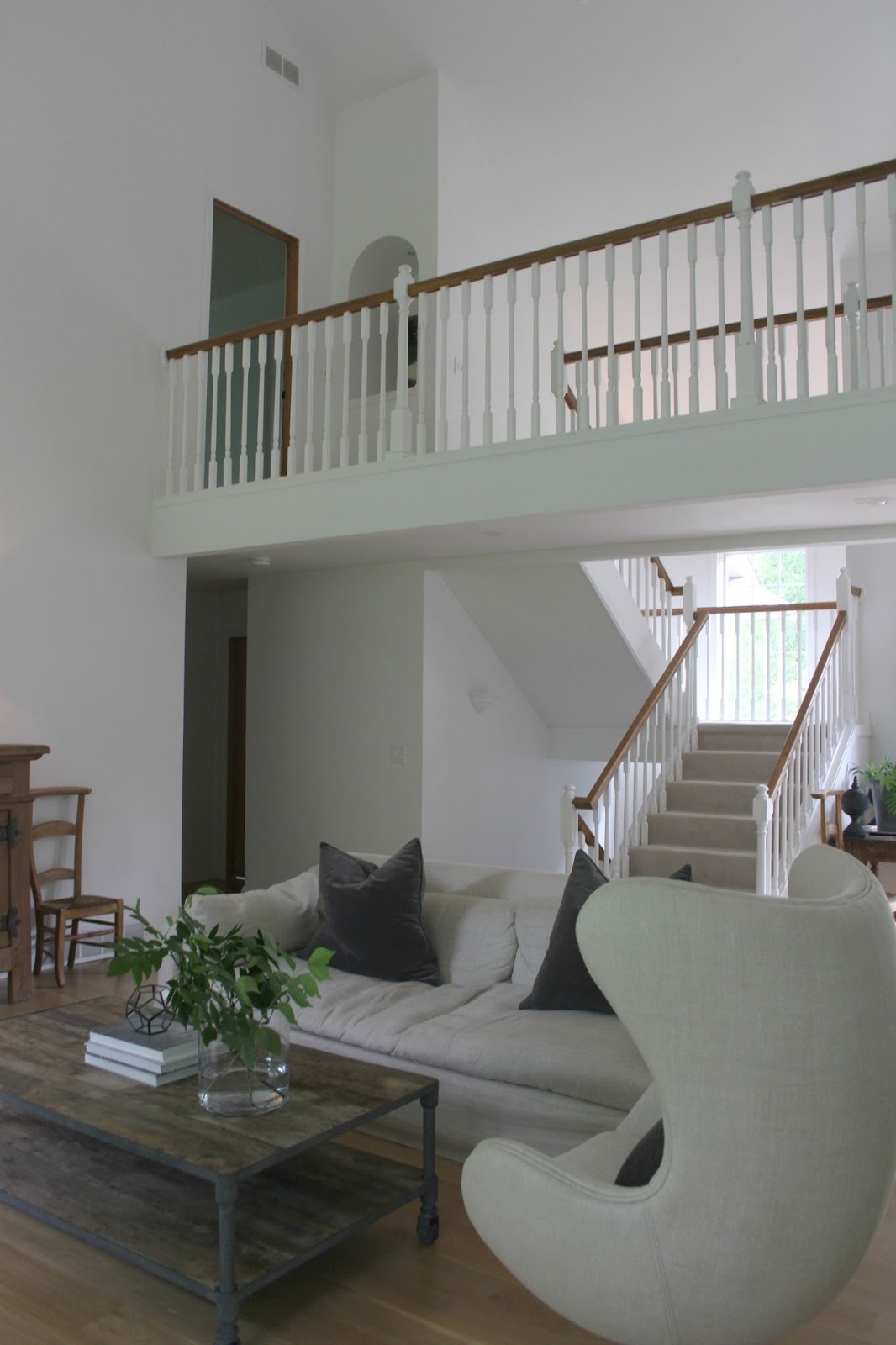 My living room with Benjamin Moore "White" walls, catwalk, and Belgian linen furniture. Come be inspired on Hello Lovely by 7 Low Cost Timeless Decorating Ideas That Don't Involve the Dollar Store As Well As Photos Around My House.