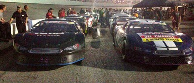 The cars sit on pit road waiting for qualifying for the Snowball Derby at Five Flags Speedway in Pensacola, Fla., on Friday, Dec. 6, 2013.