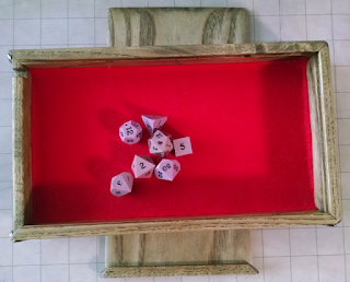 One set of standard dice in the tray