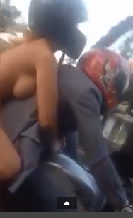 3 Woman is filmed riding on a bike dressed in just her panties and a pair of trainers
