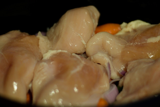 The boneless skinless chicken breasts in the crock pot.