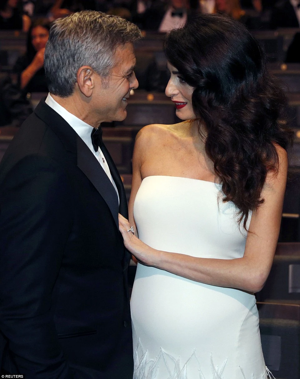 Amal Clooney debuts baby bump at the 42nd Cesar Awards