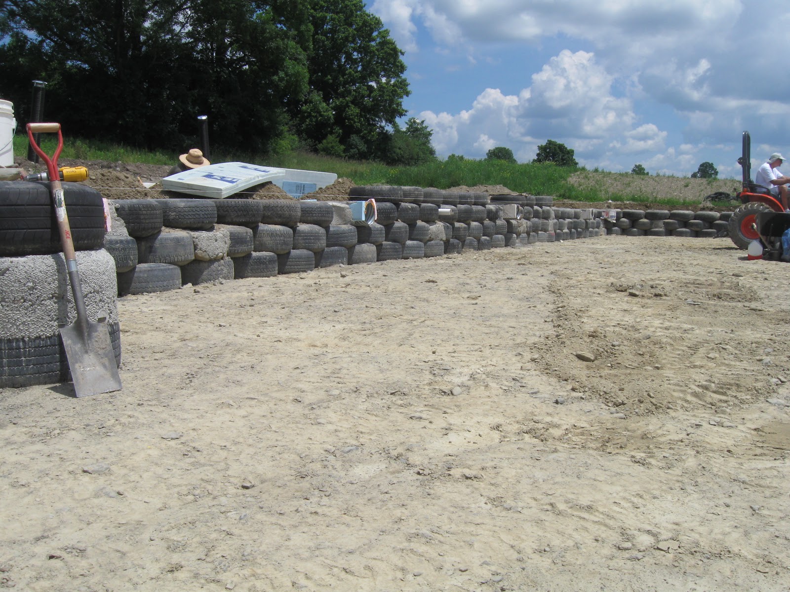 The Freeville Earthship: 2nd tier of thermal wrap, Cisterns in place!