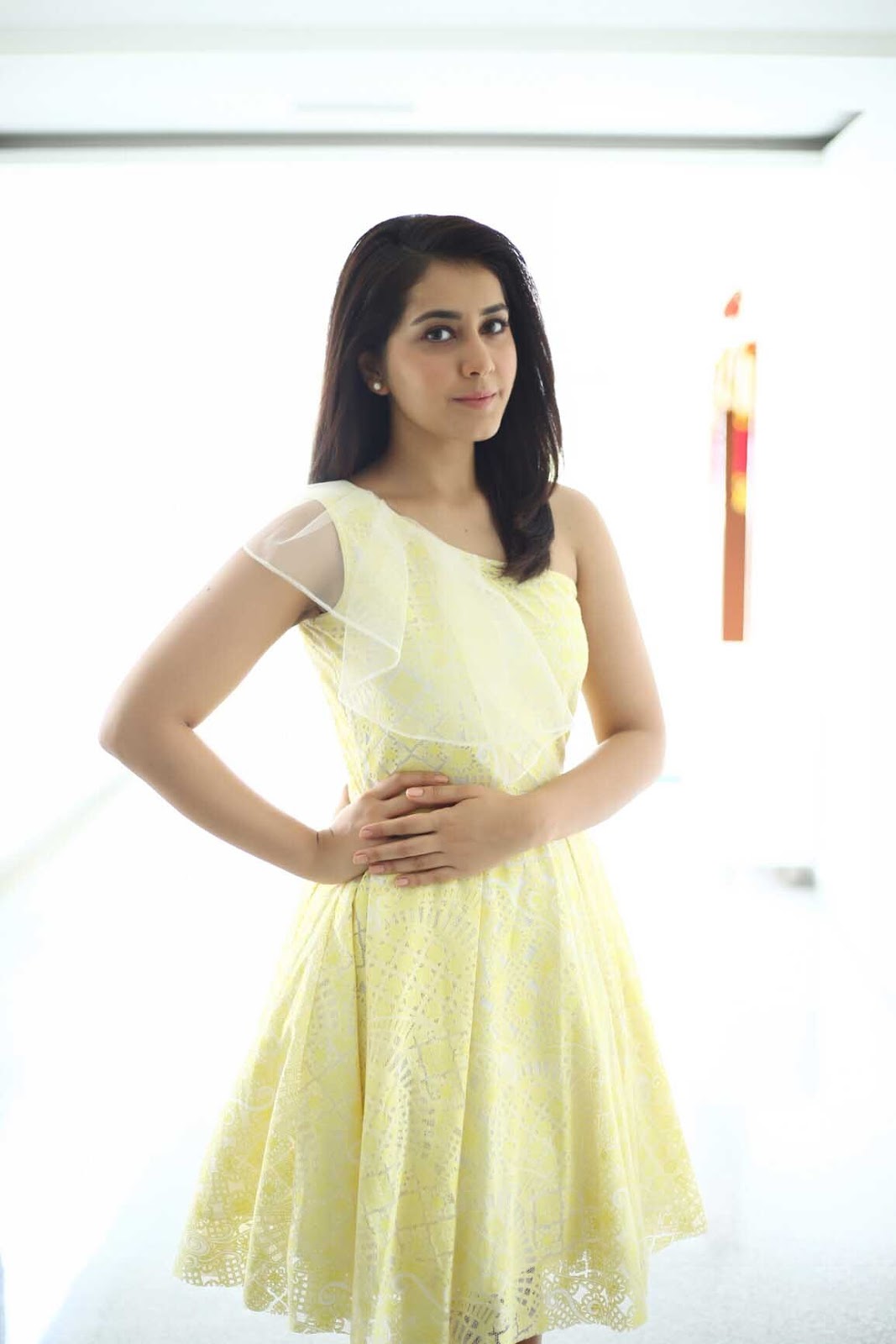 Tollywood Actress Rashi Khanna Beautiful Photoshoot In Yellow Mini Skirt