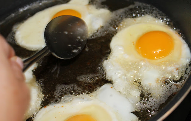 Baste the eggs with bacon fat. Fry eggs in bacon fat