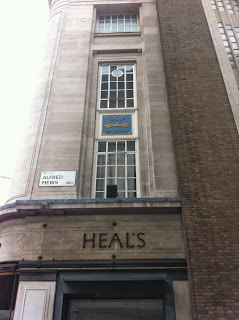 Old signs on the side of Heal's separtment store, Alfred Mews, London