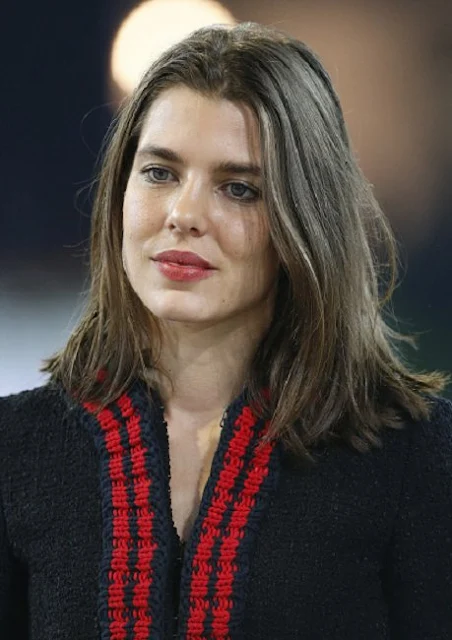 Charlotte Casiraghi  present the trophies to the GUCCI Gold Cup (CSI5) podium, winner Simon Delestre of France, second Patrice Delaveau of France  and third Maikel van der Vleuten of The Netherlands prior to the 'Style and Competition' show jumping charity event benefitting 'AMADE' on day three of the Longines Paris Masters 2015 held at the Paris-Nord Villepinte Exhibition Center