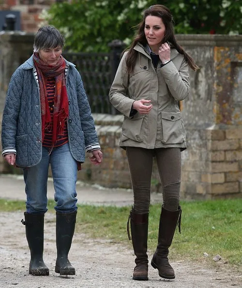 Kate Middleton wore Troy London Wax Parka, Jigsaw Cashmere Jumper, Zara Trousers, Penelope Chilvers boot, Kiki Lauren Earrings