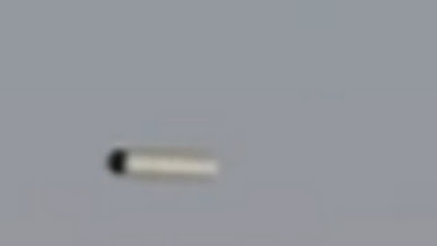 The Sun is shining off the Cigar shaped UFO which makes me think this is real.