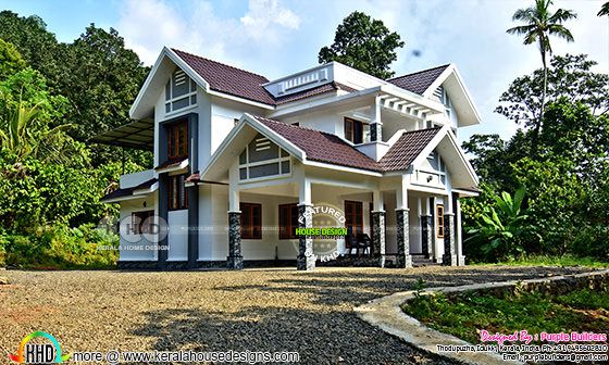 Finished house in Kerala with purple roof