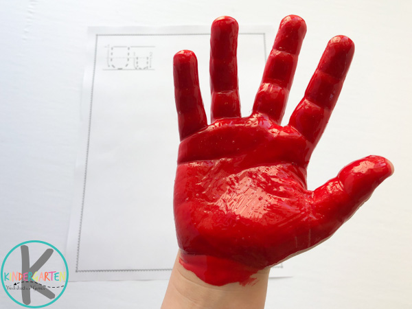 red paint on kids hand