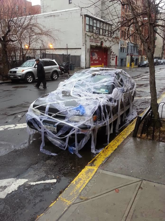 EV Grieve OK, who wrapped this car with toilet paper on East 2nd Street?